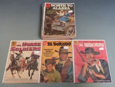 Twenty-four Dell and Gold Key Western comics including John Wayne, Maverick, Have Gun Will Travel,