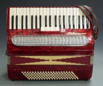 Pigliacampo Numano 120 bass piano accordion, in red pearloid finish with two treble couplers,