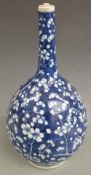 A 19thC Chinese blue and white bottle vase decorated with prunus blossom, 40cm tall.