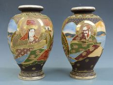 A pair of Japanese Satsuma vases with gilt and figural decoration, H29cm