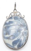 A silver pendant set with a section of Ming dynasty Chinese blue and white porcelain  COLLECTING