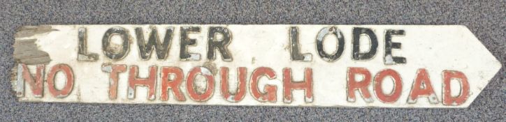 Traditional English wooden crossroads sign with screwed on letters 'Lower Lode - no through road' of