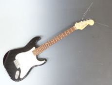 Fleetwood Strat style rhythm/ lead guitar black lacquered finish with ivory coloured finger board
