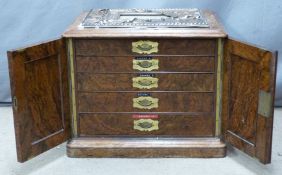 Victorian burr walnut collector's cabinet, the twin arched panelled doors opening to reveal five