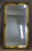 Bevelled glass gilt framed mirror, 77 x 140cm