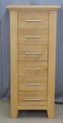 Contemporary light oak chest of six straight drawers, W52 x D36 x H116cm