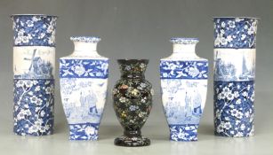 Two pairs of Oriental style vases decorated with chinoiserie scenes and prunus blossom, tallest