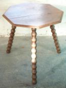 An oak cricket table with bobbin turned legs, H61 x diameter 60cm