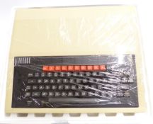 An early BBC microcomputer by Acorn, in original packaging and box