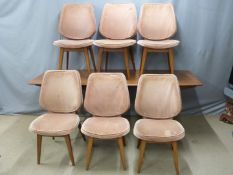 A retro/mid century modern teak shaped dining table and six chairs, purchased from Heals, possibly