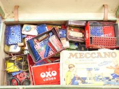 A collection of loose Meccano pieces and various accessory outfit instructions.