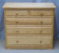 A contemporary light oak chest of two over three graduated drawers, W89 x D44 x H75cm