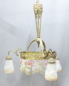 An ornate brass electrolier/ chandelier with opaque glass shade and bead fringe, H98 x D63cm