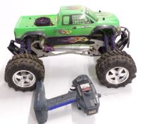 Savage HPI Racing nitro powered radio controlled monster truck with Aggressor SRX radio transmitter.