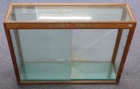 Dinky Toys shop display or advertising display cabinet with glass shelves and sliding doors,