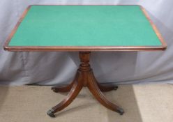 A mahogany fold over card table raised on a pedestal base, W 85, D 42, H 75cm