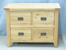 A contemporary light oak chest of four drawers, W100 x D40 x H76cm