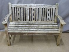 A teak garden bench, W130cm