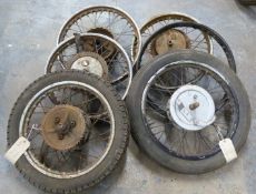 Six motorbike wheels including early AMC/Ariel/Francis Barnett