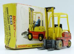 Dinky Toys diecast model Conveyancer Fork Lift Truck with yellow and orange body and yellow hubs,