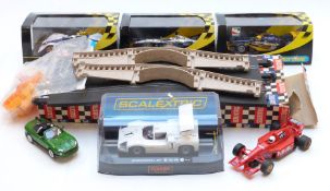 Six Scalextric model motor racing cars including James Bond Formula 1 etc, four in original boxes,