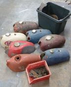 Seven motorbike petrol tanks and engine plates