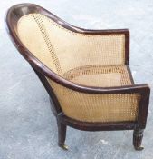 A 19thC bergere armchair with mahogany frame