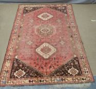 A large Persian rug, 380 x 270cm