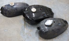 Three motorbike petrol tanks including BSA Sprite