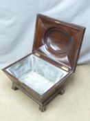 A 19thC Georgian style mahogany sarcophagus shaped cellarette/ wine cooler with domed top, feathered