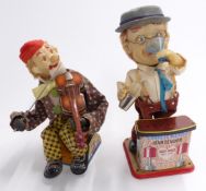 Two battery operated tinplate novelty figures Rosko Toys Charley Weaver Bartender and Alps of