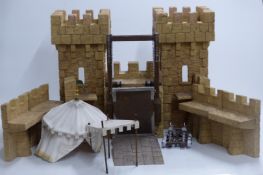 Schleich children's castle playset including accessories, flags and catapult