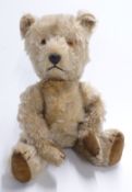 Vintage straw filled Teddy bear with blonde mohair, disc joints, felt pads and stitched features,