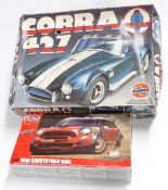Two Airfix plastic model kits 1:16 scale Cobra 427 kit and 1:32 scale Mini Countryman WRC, both in