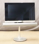 Bang and Olufsen Beovision 7 television on stand, 52 x 89cm