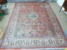 Turkoman rug with three guls on a pink/ wine ground, 312 x 204cm