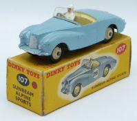 Dinky Toys diecast model Sunbeam Alpine Sports with blue body, white driver, beige interior and