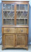 A 19thC oak astragal glazed secretaire/bureau bookcase with fitted interior, Samuel Hall and Sons,