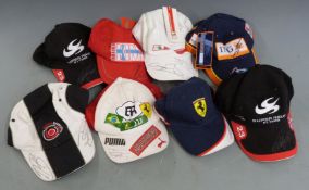Eight motor racing caps, each signed by a Formula 1 driver including Jensen Button, Felipe Massa,
