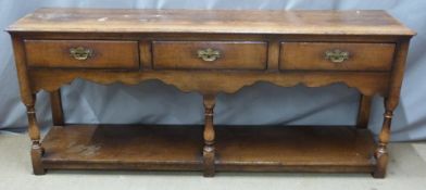 Georgian style oak dresser with three straight drawers, shaped apron and undershelf, W183 x D465 x