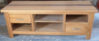 A contemporary light oak low sideboard, W150 x D50 x H60cm