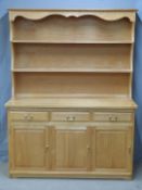 A contemporary light oak or ash dresser, W133 x D49 x H173cm