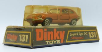 Dinky Toys diecast model Jaguar E Type 2+2 with Speedwheels, bronze body, pale blue interior and