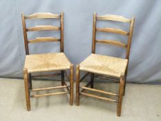 Pair of Cotswold School Arts and Crafts oak ladderback chairs