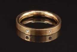 An 18ct gold eternity ring with a matte finish, set with diamonds, size N, 4.7g