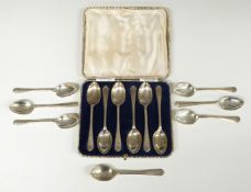 Cased set of six hallmarked silver Walker & Hall golf spoons together with a further set of six