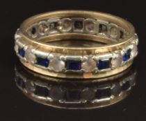 A 9ct gold eternity ring set with sapphires and paste, size Q, 4g