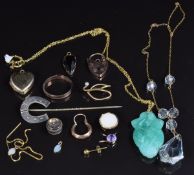 A 9ct gold locket (2.9g), rose metal padlock (1.8g), Victorian silver horseshoe stick pin, 14k