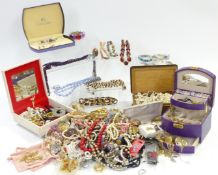 A collection of costume jewellery including brooches, necklaces, etc