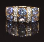 A 9ct gold ring set with diamonds and tanzanites, size L, 4.3g